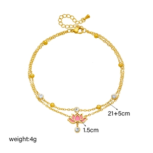 Double-layered gold anklet with pink enamel lotus pendant and sparkling crystals