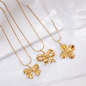 Elegant gold-plated stainless steel necklaces with bow and floral pendants on ball chains