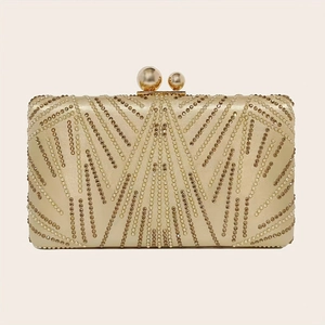 Detail of evening clutch with gold and silver pearls and rhinestones in fan pattern