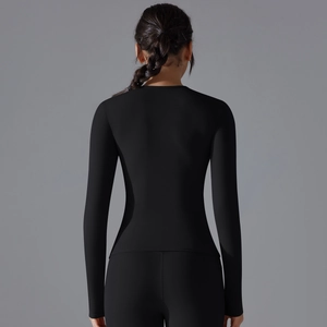 Rear view of sleek black long sleeve athletic top with body-shaping elastic fabric