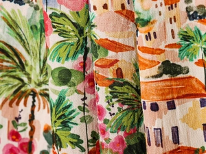 Macro shot of colorful resort-style print fabric showing detailed crêpe texture and drape