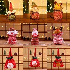 Detail view of 22cm Christmas drawstring gift bags featuring 3D Santa and snowman designs