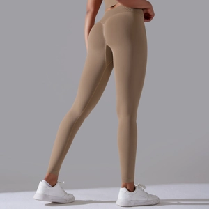Detail of seamless khaki brown leggings with high-waisted design and scrunch butt effect