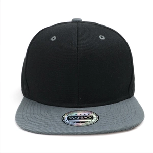 Close-up of black and grey snapback hat featuring a round laser sticker on a flat brim