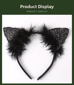 Detail of black cat ear headband with shiny sequins and soft feather trim for Halloween