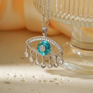 Fashionable evil eye pendant necklace with blue gemstone and hanging clear cubic zirconia