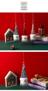 Detail of glowing Christmas gnome ornaments with sequins and plush beards on a red festive base
