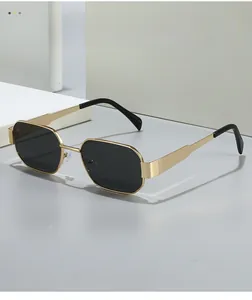 Detail shot of vintage polygonal gold metal frame sunglasses with dark lenses