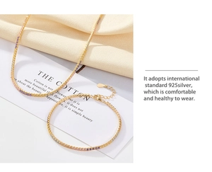 Detail of 925 sterling silver gold necklace and bracelet set with colorful zircon stones