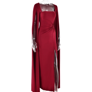 Detail of elegant red floor-length dress with cape sleeves and high side slit detail