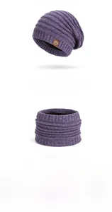 Detail of purple striped knitted beanie and scarf set with thick fleece lining and leather patch