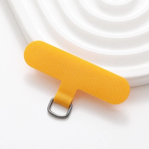 Detailed view of orange T-shaped phone lanyard patch with durable metal D-ring attachment