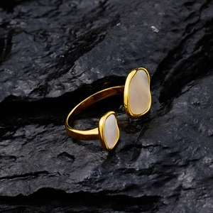 Adjustable golden stainless steel open ring with oval shell inlay on dark rock base