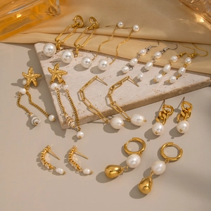 Elegant gold baroque freshwater pearl earring set with tassel and starfish designs