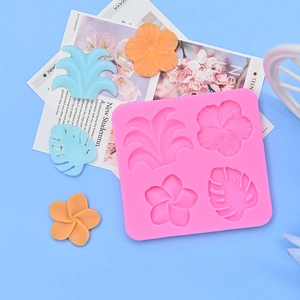 Detailed pink silicone mold for tropical hibiscus and palm leaf fondant decorations