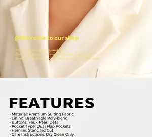 Detailed close-up of a 18k gold plated chunky buckle chain necklace on a white blazer