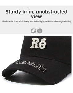Detail of black cotton baseball cap with 3D embroidery and stiff sunshade brim