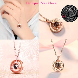 Detail view of rose gold projection necklace with Roman numerals and 100 languages text