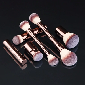 Detail view of 7-piece makeup brush set with rose gold handles and gradient bristles
