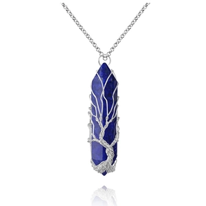 Detailed macro view of handmade tree of life wire wrapped lapis lazuli crystal pendant