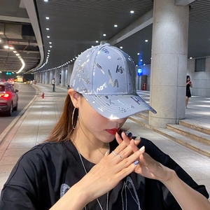 Grey-blue reflective graffiti baseball cap for men and women in urban night setting