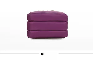 Detail view of the triple-layer accordion structure of the purple nylon shoulder bag