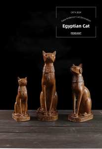 Detailed view of three Egyptian cat statues in wood-like resin with EGYPT engraving