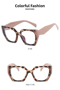 Detail view of retro geometric hexagonal frames with tortoiseshell pattern and pink temples