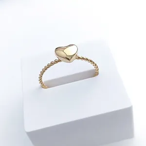 Polished gold heart ring with twisted rope band made of high-quality stainless steel