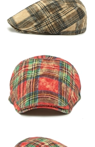 Detailed view of British style plaid flat caps in vintage brown and red-green check patterns