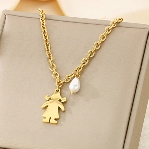 Detail of gold chain necklace with minimalist girl silhouette and baroque pearl pendant