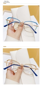 Detail of cat-eye metal frame glasses in blue-cyan gradient and gold finish accents