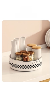 Close-up of a white rotating kitchen rack tray with checkers pattern for condiment storage