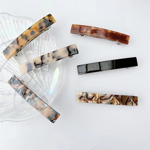 Detailed set of six rectangular acetate spring hair clips in tortoiseshell and marble patterns