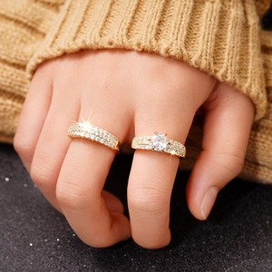 Close-up of luxury gold-plated wedding ring set with sparkling white zircon stones