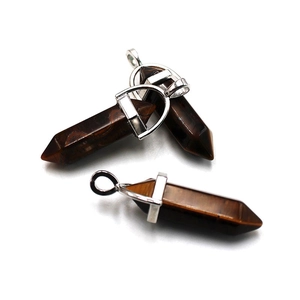 Natural tiger eye hexagonal crystal pendants with silver metal clasps on white background