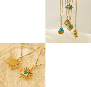 Detailed macro view of gold-plated sunburst pendant with turquoise inlay on steel chain