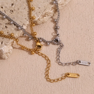Detail of 18K gold and silver beaded O-chains with lobster clasp and K18 engraving