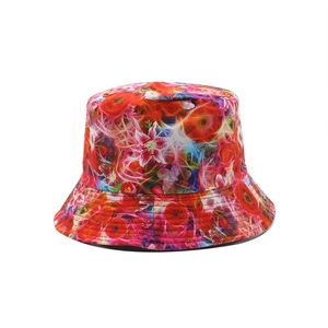Double-sided reversible bucket hat featuring vibrant red and orange abstract floral prints