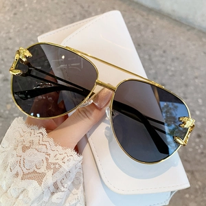 Golden aviator sunglasses with leopard head metal accent and dark lenses for unisex style