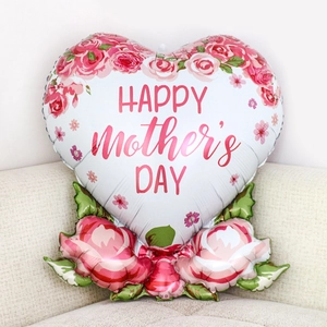 Detail of a white heart foil balloon with pink flowers and Happy Mother's Day text