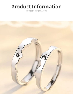 Close-up of silver couples rings featuring mountain waves with sun and moon engravings