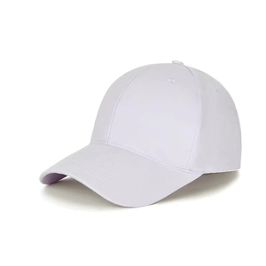 Detail of white cotton twill baseball cap showing six-panel crown and curved brim