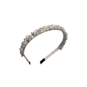 Sparkling silver headband with square and round rhinestones on a white background