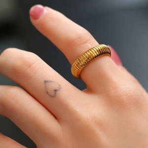 Chic gold croissant dome ring in stainless steel with a pleated spiral texture design