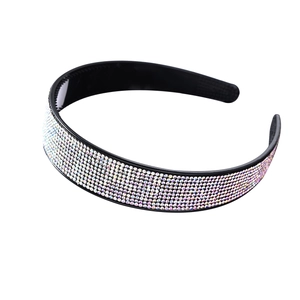 Sparkling rhinestone headband with iridescent AB crystals on a black base for women