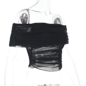 Detail of black off-shoulder mesh top showing layered pleats and sheer fabric texture