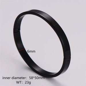 Detail view of 6mm black matte stainless steel oval bangle with hinge closure mechanism