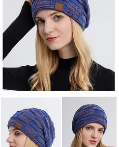 Detail of blue-purple knit beanie showing thick texture and mountain leather patch