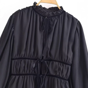 French retro black blouse with ruffled high neck and elegant velvet bow tie decoration